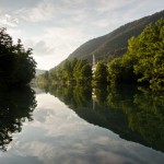 mosque before sunset reflecting in water